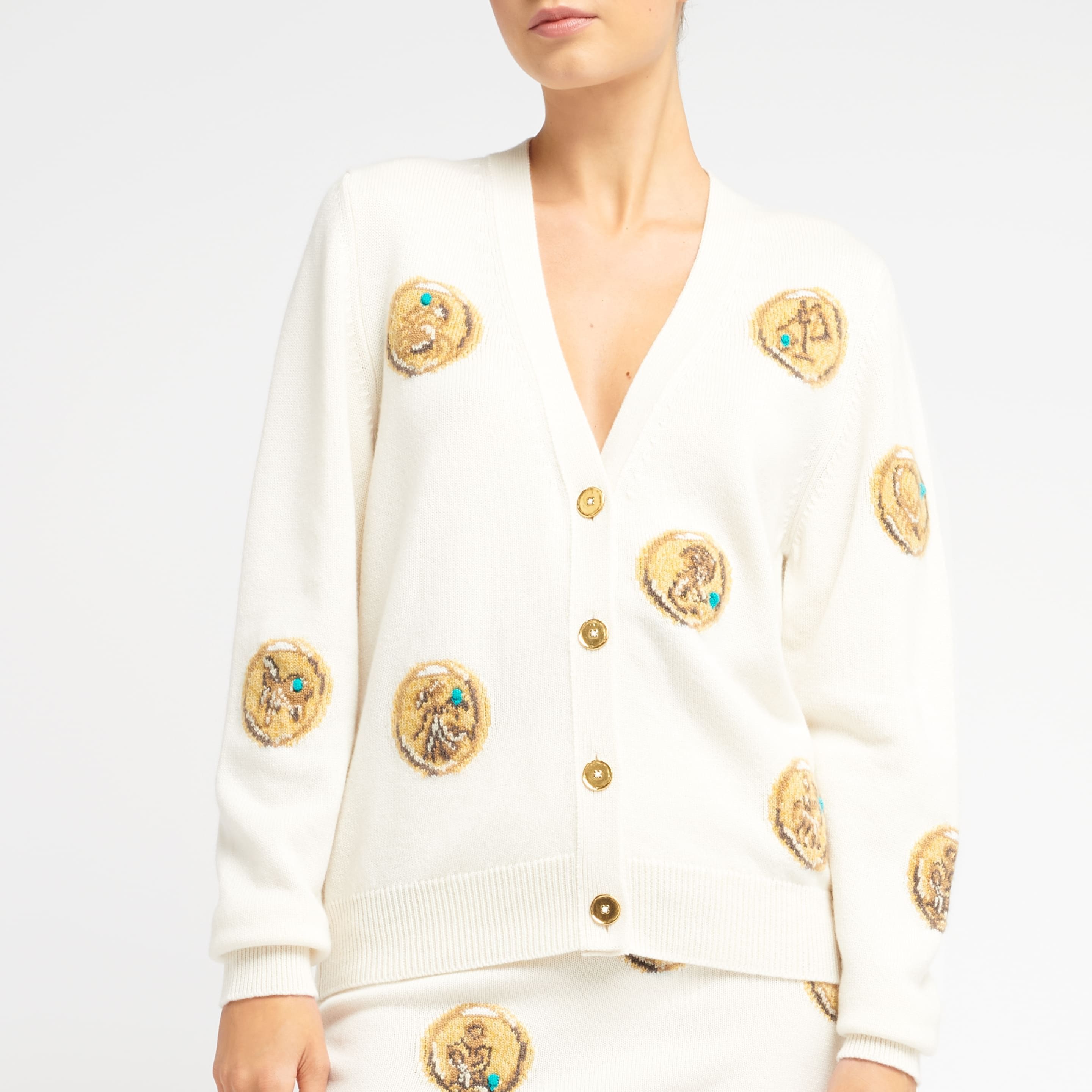 Cardigan in cashmere with a zodiac motif